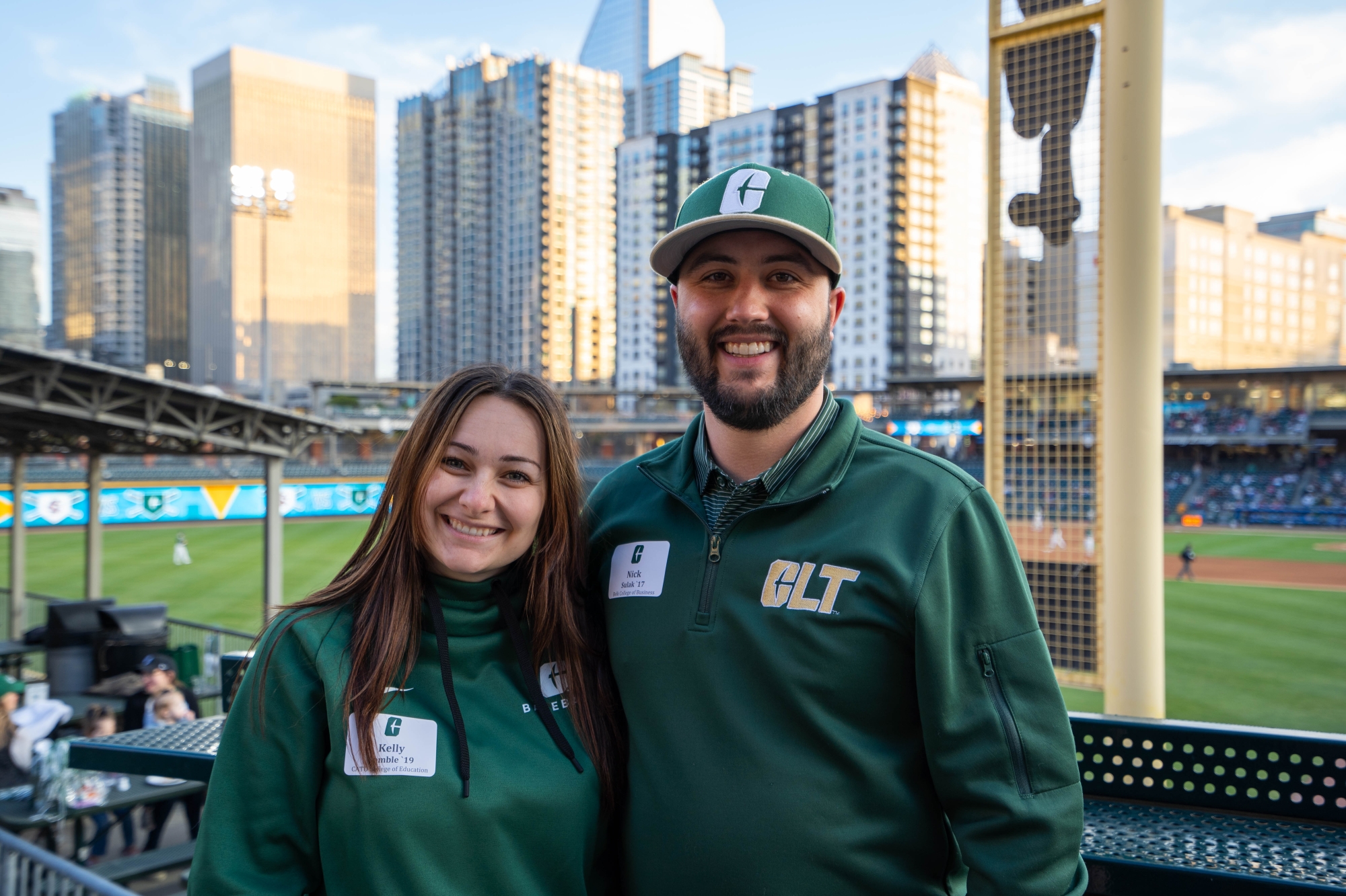 Alumni Business Niner Nick Sulak (right) at Truist Field in Uptown Charlotte