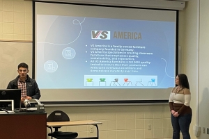 Group of students delivering their VS America presentation 