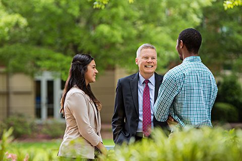 Former Dean Steven Ott with Belk College students