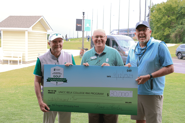 RMI faculty member Tom Marshall, Dean Richard Buttimer and Tournament Director Ross Fowler