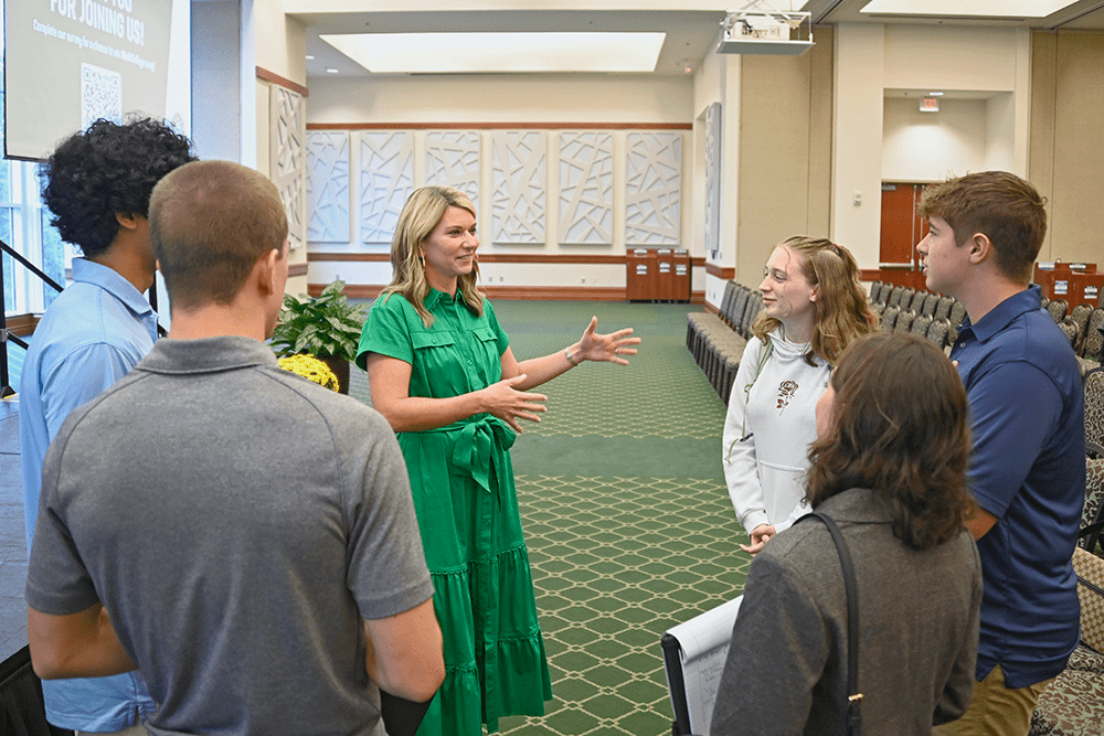 Ali Summerville chatted with small groups of students following the event, offering encouragement and insight.