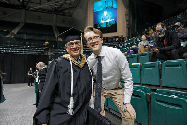 Scott Stewart Sr and Jr at UNC Charlotte's commencement ceremony