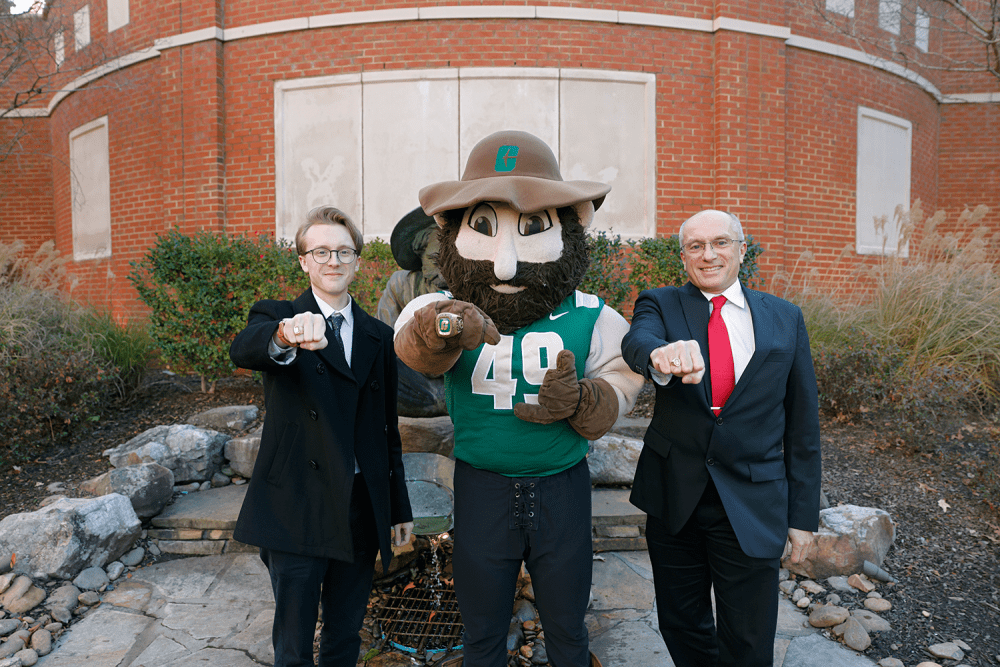 Scott Stewart Jr. ’24, Norm and Scott Stewart Sr. ’24 MBA show off their class rings