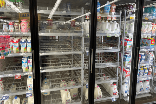 Adobe stock image of empty dairy shelves in a supermarket