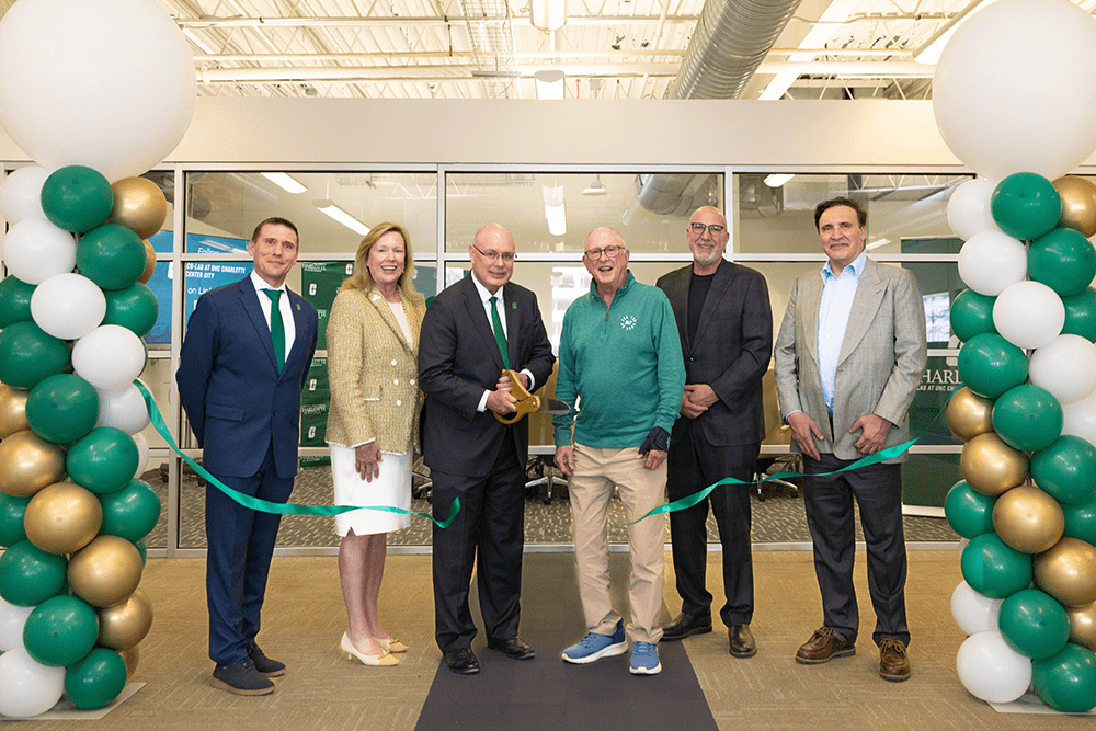 Dr. Brad Yeckley, Chancellor Sharon Gaber, Dean Richard Buttimer, Gene Johnson ’73, David Longo and Murray Grenville.