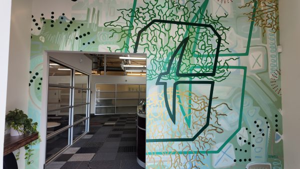 UNC Charlotte alumna Sharon Dowell ’02 collaborated with current visual arts students to transform the entrance to the University’s Center City innovation hub.