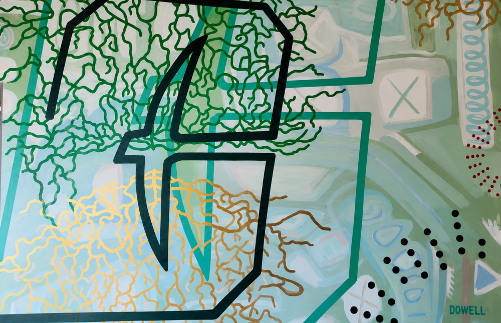 Colorful mural by Sharon Dowell surrounding the entrance to CO-LAB at UNC Charlotte Center City.